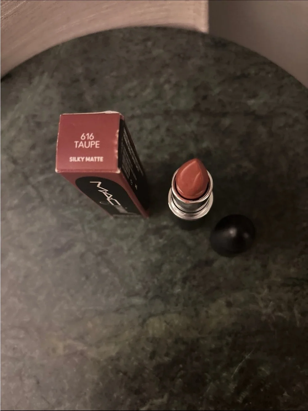 Mac lipstick in the shade 616 taupe silky mat